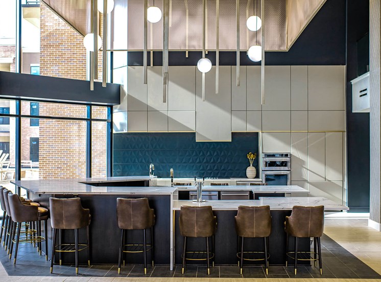 barstools around a counter in an indoor kitchen